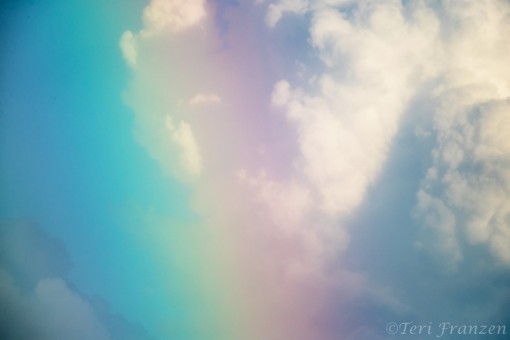 Rainbow and Cumulus Clouds